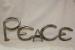 PEACE: welded metal horseshoe art sculpture